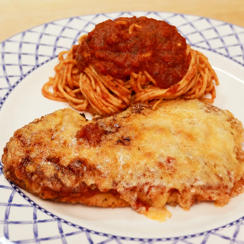 easy classic chicken parmigiana with spaghetti, finished dish