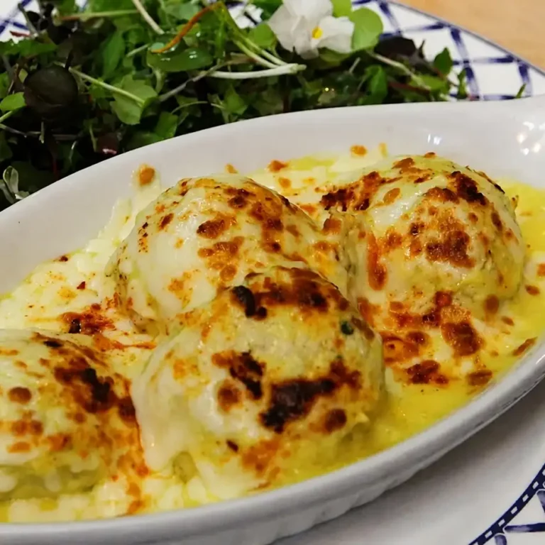 Chicken Quenelles Gratin&eacute;ed with Creamy Tarragon Sauce