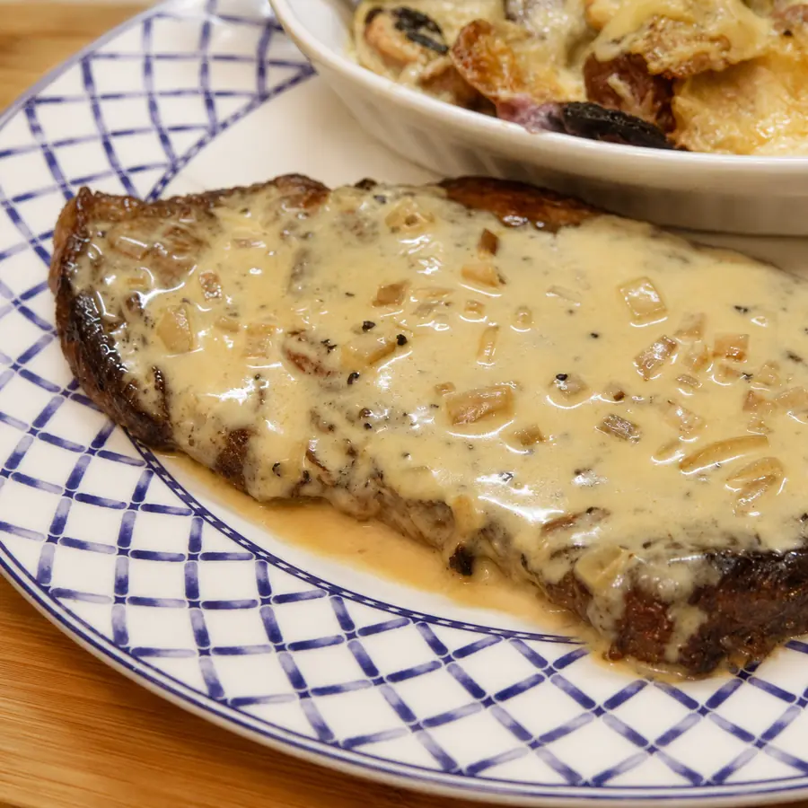 pan seared steak three cheese sauce potato gratin, finished dish