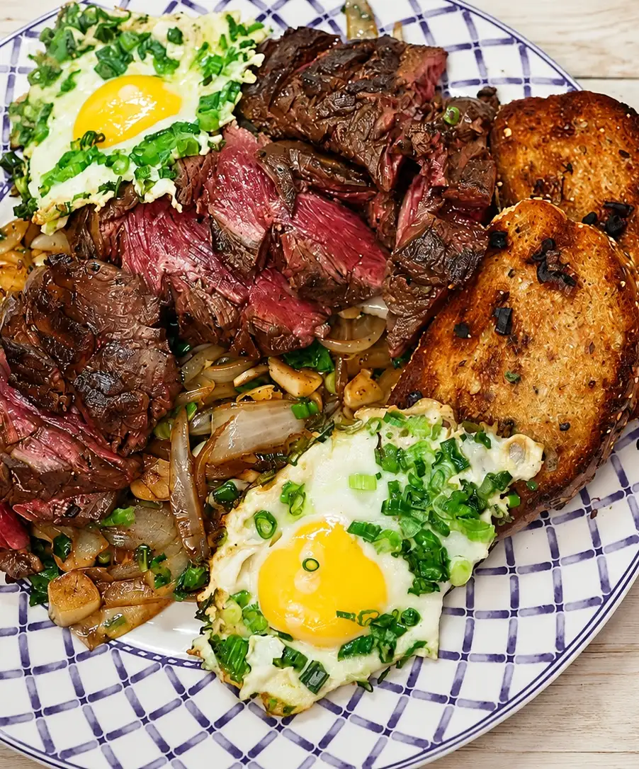 steak and eggs breakfast garlic onions, finished dish