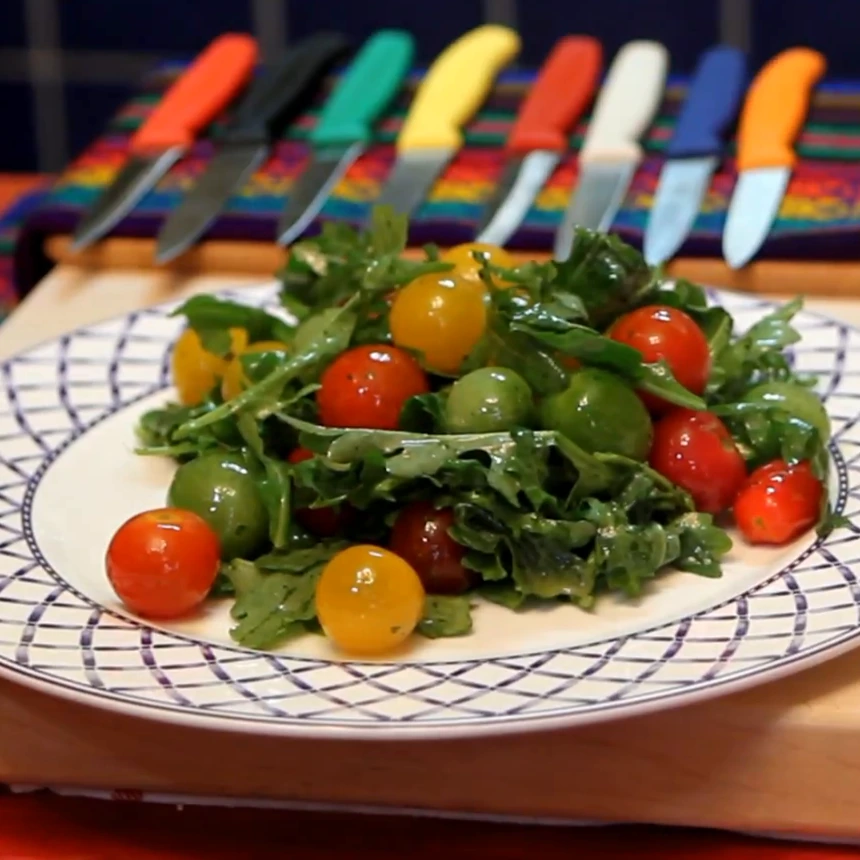 arugula cherry tomato salad mint lemon dressing, finished dish