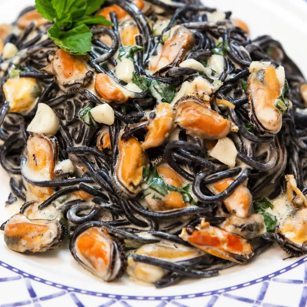 black capellini mussels garlic cream, finished dish