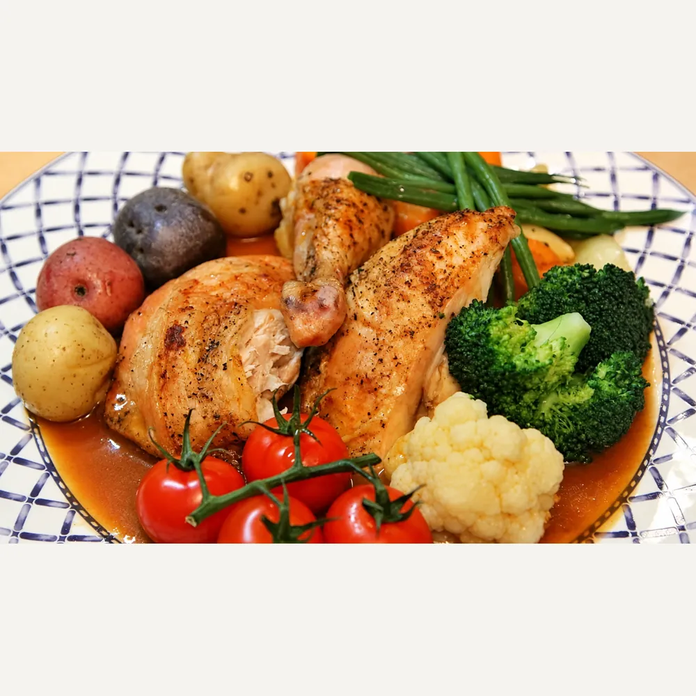 Poulet rôti en crapaudine à la poêle, épices cajun et légumes